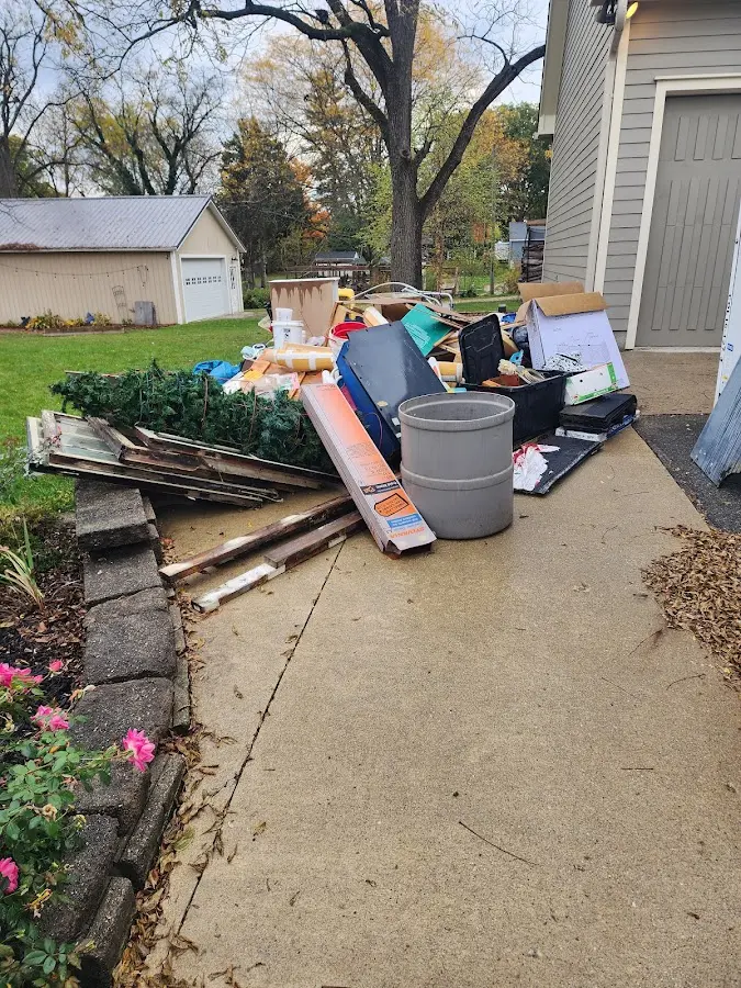 Dumpster being loaded with debris for 10 Yard Dumpster Rental in Aptos